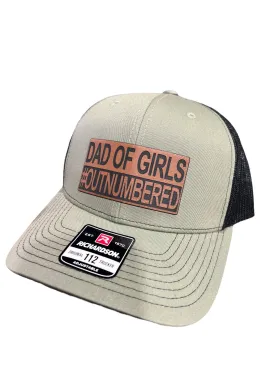 Dad of Girls OUTNUMBERED Leatherette Patch Hat is a Richardson 112 Trucker Hat with adjustable snapback.